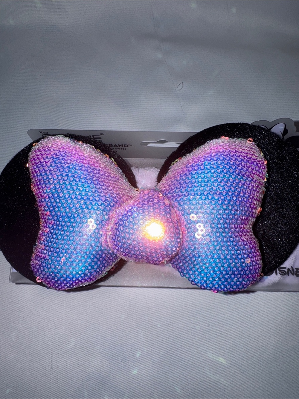 Disney/The Crème Shop Iridescent Pink/ Lavender Sequin Bow Minnie Ears Headband